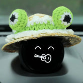 The wide brim of the hat just covers NOMI's face.