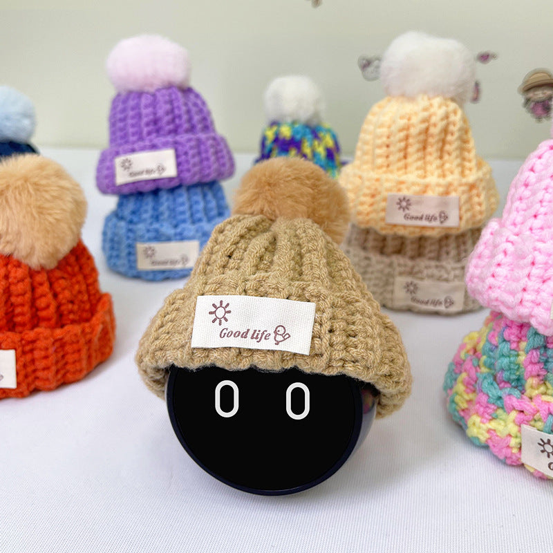 The khaki hat makes NOMI look warm.