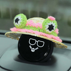 The frog eyes knitted decoration on the hat is fun and interesting.