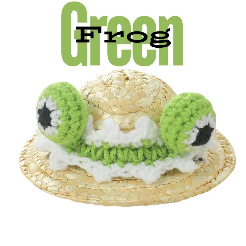 The frog eyes on the straw hat are knitted with green wool and are decorated with white knitted lace around them.