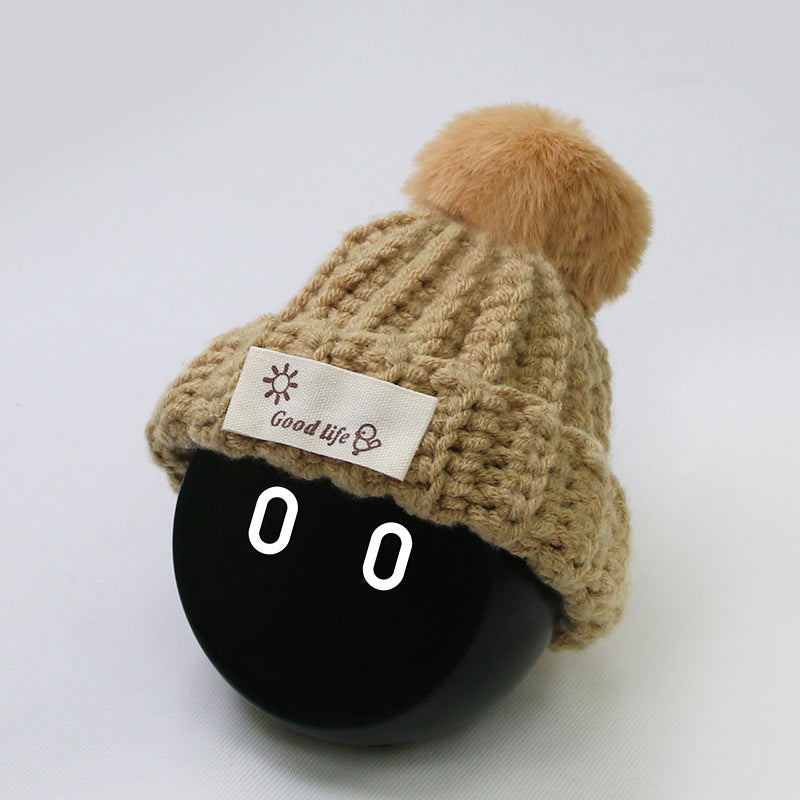 The Khaki Wool hat worn on NOMI.