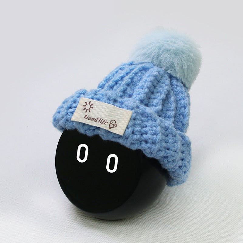 Light blue knitted hat.