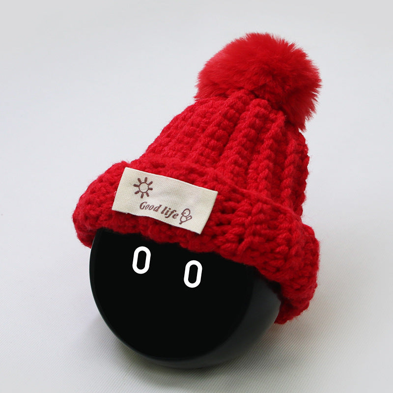 The entire woolen hat is knitted with pure red wool.