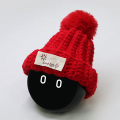 The entire woolen hat is knitted with pure red wool.